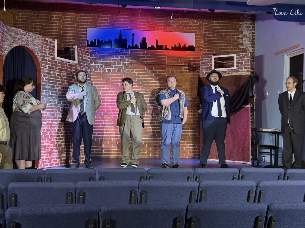 Big musical number, hands raised